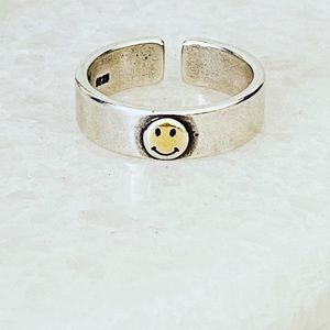 The small smiley face adjustable ring.